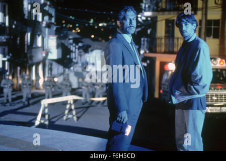 Jan 11, 2002; Madrid, SPAIN; JAVIER BARDEM (left) as Det. Lt. Agustin Rejas and JUAN DIEGO BOTTO as Det. Sgt. Sucre in the crime, thriller, drama ''The Dancer Upstairs'' directed by John Malkovich. Stock Photo