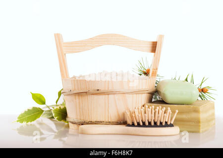 Aromatic bath salt in wooden bucket and handmade soap Stock Photo