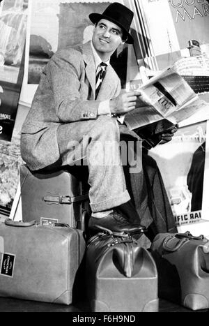 1938, Film Title: HOLIDAY, Director: GEORGE CUKOR, Studio: COLUMBIA, Pictured: 1938, CARY GRANT, PAPER, NEWSPAPER. (Credit Image: SNAP) Stock Photo