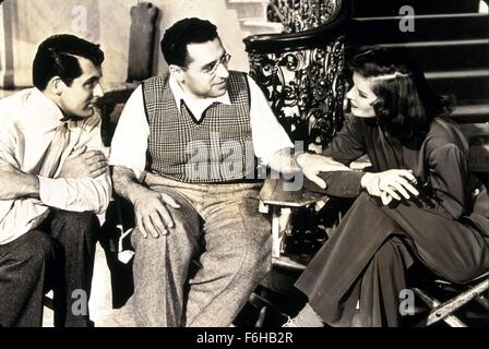 1938, Film Title: HOLIDAY, Director: GEORGE CUKOR, Studio: COLUMBIA, Pictured: GEORGE CUKOR, CARY GRANT, KATHARINE HEPBURN, MOVIE SET, ADMIRING, LISTENING, DIRECTOR DIRECTS, TOUCHING, SITTING. (Credit Image: SNAP) Stock Photo
