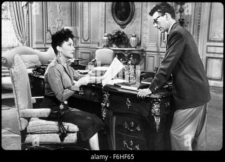 1953, Film Title: CALL ME MADAM, Director: WALTER LANG, Studio: FOX, Pictured: 1953, LADY IS THE BOSS, ETHEL MERMAN, DONALD O'CONNOR, DESK, READING, CRITICIZING, CONDESCENDING, BELITTLING, PATRONIZING, OFFICE, BOSSY, HIGH CLASS, BOURGEOIS, WEALTHY, ORNATE, NEGOTIATING, MEETING. (Credit Image: SNAP) Stock Photo