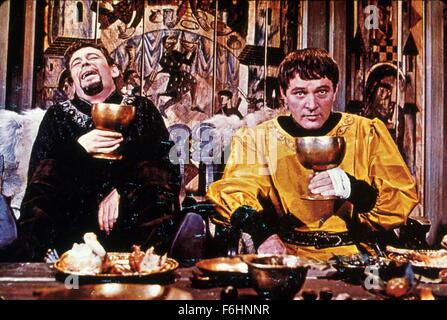 1964, Film Title: BECKET, Director: PETER GLENVILLE, Studio: PARAMOUNT, Pictured: RICHARD BURTON, CHARACTER, PETER GLENVILLE, HENRY II: KING OF ENGLAND, PETER O'TOOLE, THOMAS BECKET: ARCH OF CANT, DRINKING, FILM STILL, DRUNK, DECADENCE, WEALTH, CHALICE, LAUGHING, GREED. (Credit Image: SNAP) Stock Photo