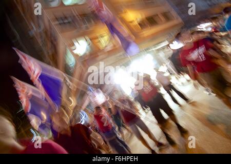 Mong Kok, Hong Kong. 17th Nov, 2015, Hong Kong v China for World Cup qualification. Outside Mong Kok Stadium, Hong Kong football fans show there differences to the mainland by waving the old British colonial flag of Hong Kong. Alistair Ruff/Alamy Live News Stock Photo