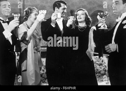 1938, Film Title: HOLIDAY, Director: GEORGE CUKOR, Studio: COLUMBIA, Pictured: CARY GRANT, GROUP, KATHARINE HEPBURN, TOASTING DRINKS, ELEGANT. (Credit Image: SNAP) Stock Photo