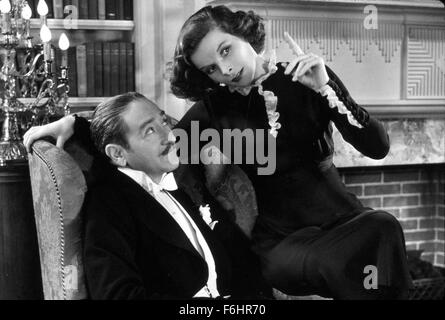 1933, Film Title: MORNING GLORY, Director: LOWELL SHERMAN, Studio: RKO, Pictured: 1933, AWARDS - ACADEMY, BEST ACTRESS, KATHARINE HEPBURN, ADOLPHE MENJOU, EXPLAINING, POINTING, CHARMING, TUXEDO, SITTING ON LAP, FILM STILL, MOUSTACHE. (Credit Image: SNAP) Stock Photo