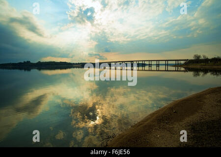 Sunset over Palmar reservoir and the large bridge crossing it Stock ...