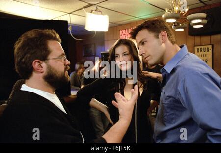 RELEASE DATE: March 26, 2004. MOVIE TITLE: Jersey Girl. STUDIO: Miramax Films. PLOT: After his career is sidelined from an unexpected tragedy and a personal blowup, a single man must take care of his precocious daughter. PICTURED: Director KEVIN SMITH with actors LIV TYLER and BEN AFFLECK on the set. Stock Photo