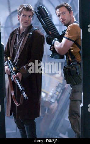 RELEASE DATE: September 30, 2005. MOVIE TITLE: Serenity. STUDIO: Universal Pictures. PLOT: The crew of the ship Serenity tries to evade an assassin sent to recapture one of their number who is telepathic. PICTURED: NATHAN FILLION stars as Captain Malcolm Reynolds and ADAM BALDWIN as Jayne. Stock Photo