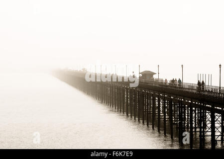 Southend pier disappearing in to the fog. Stock Photo
