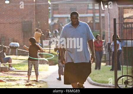 RELEASE DATE: November 20, 2009. MOVIE TITLE: The Blind Side. STUDIO: Alcon Entertainment. PLOT: The story of Michael Oher, a homeless and traumatized boy who became an All American football player and first round NFL draft pick with the help of a caring woman and her family. PICTURED: QUINTON AARON as Michael Oher. Stock Photo