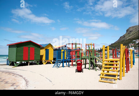 Children's playground and changing huts on the beach in the seaside resort of Muizenberg near Cape Town South Africa Stock Photo