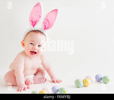 Baby with bunny ears Stock Photo