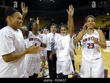 Las Cruces, NM, USA. 17th Nov, 2015. New Mexico State head coach Mark Trakh, center, celebrates with his players the 78-59 victory over New Mexico at the end of an NCAA college basketball game in Las Cruces, N.M., Tuesday, Nov. 17, 2015. © Andres Leighton/Albuquerque Journal/ZUMA Wire/Alamy Live News Stock Photo