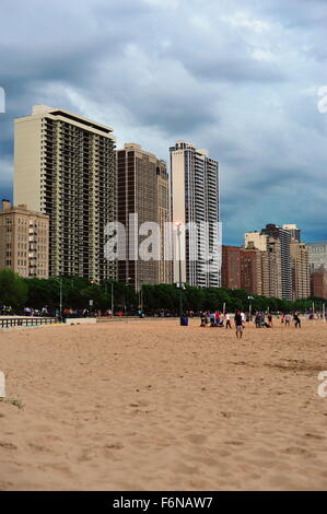 Storm clouds move in from behind high rise residences that flank north Lake Shore Drive and Oak Street Beach in Chicago, Illinois, USA. Stock Photo