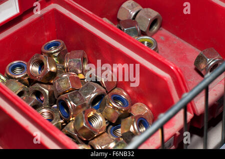 Nuts in a drawer from a spare parts store Stock Photo