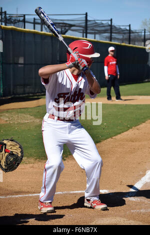 Grapevine Faith High School baseball player batting during a game. Stock Photo
