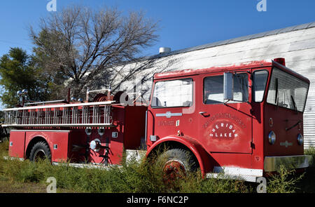 An old abandoned fire truck sitting in a field in Sheridan Lake, Colorado. Stock Photo