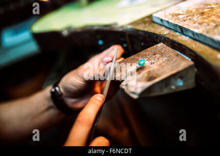 Jeweler working on ring in his workshop Stock Photo