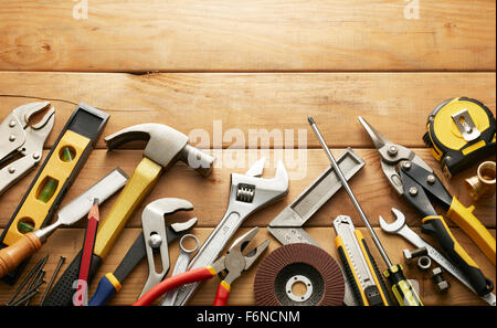 variety of tools on wood planks with copy space Stock Photo