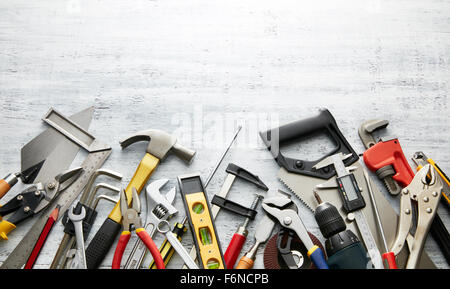 variety of tools on white textured background with copy space Stock Photo