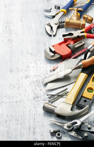 variety of tools on white textured background with copy space Stock Photo