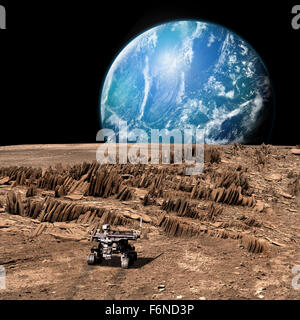 A rover explores a rocky, barren moon as a large, water covered world rises above the horizon. Stock Photo
