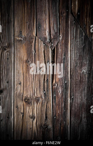 Planks of wood rotten with rusty nails stuck inside. Stock Photo