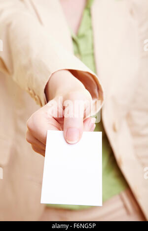Businesswoman holding an empty white business card Stock Photo