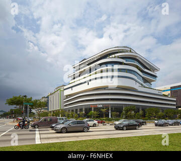 General exterior elevation across busy intersection. BreadTalk IHQ, Singapore, Singapore. Architect: Kay Ngeee Tan Architects, 2 Stock Photo