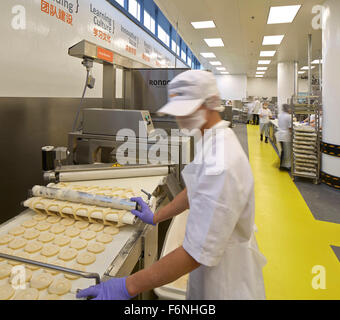 Industrial bakery with production line. BreadTalk IHQ, Singapore, Singapore. Architect: Kay Ngeee Tan Architects, 2014. Stock Photo