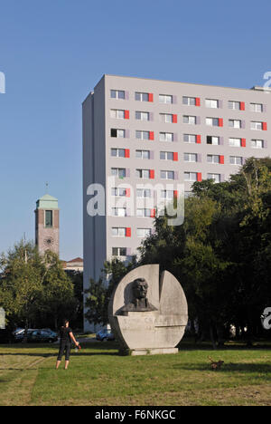 woman with dog and monument of Samo Chalupka - a Slovak romantic poet in a public park, Bratislava 1, Slovakia Stock Photo