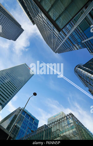 Airplane Flying Over Skyscrapers, Canary Wharf, London, England, UK Stock Photo