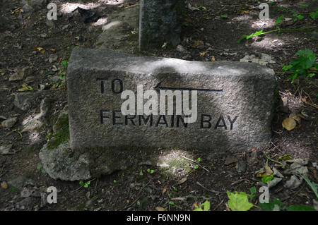 Carved Stone Waymarker to Fermain Bay on Guernsey Coastal Path Channel Islands. Stock Photo