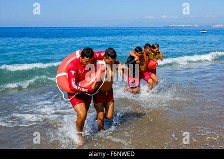 Lifeguards on the beach at Puerto Vallarta, Mexico undergoing training in rescue and lifesaving as part of their licence require Stock Photo