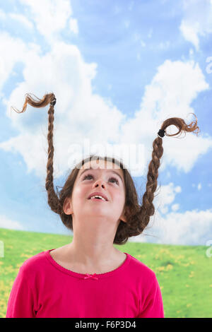 Cute little girl with long braided hair up Stock Photo