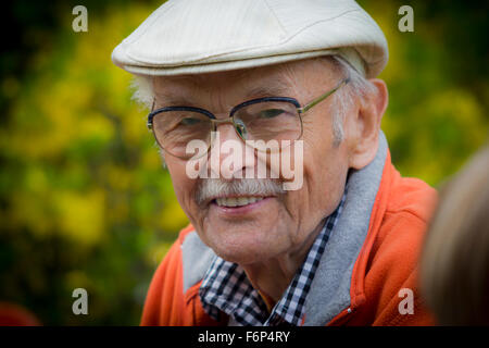 Closeup Profile on a Smiling Old Man With a Grey Beard Stock Photo