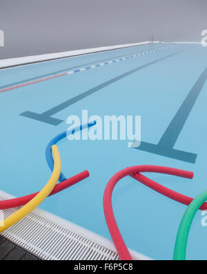Swim noodles, geothermal heated swimming pool, Wintertime, Iceland Stock Photo