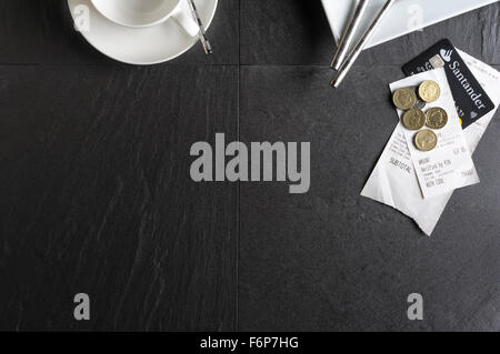 Overhead view of cafe table.Restaurant leaving a gratuity and bill paying. Leaving a tip after a meal. Stock Photo