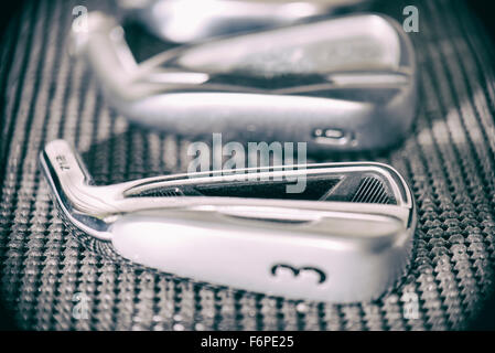 Golf club irons head macro detail in soft focus Stock Photo