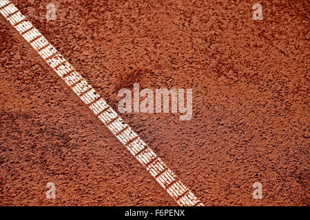 Detail with sideline and moisture on a tennis clay court Stock Photo