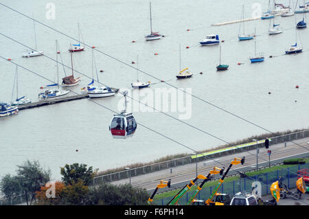 London, UK, 22 October 2015, aerial view of the Emirates Air Line terminal in North Greenwich next to the O2 dome. The Emirates Air Line is a cable car link across the River Thames in London, England built by Doppelmayr with sponsorship from the airline Emirates. The service opened on 28 June 2012 and is operated by Transport for London. In addition to transport across the river, the service advertises 'a unique view of London' Stock Photo