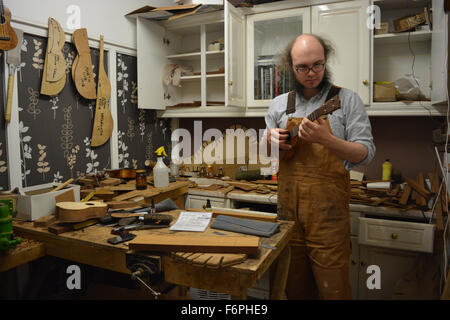 Luthier, Liam Kirby, in his ukulele and guitar workshop. Wunderkammer Musical Instrument Co. Bristol, England