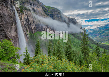 Bridal Veil Falls iand fog ,  Uncomphagre National Forest, Colorado, 365 foot falls at end of Telluride box canyon, San Juan Mou Stock Photo