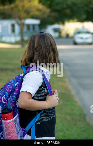 Girl waiting at the busstop Stock Photo: 117345736 - Alamy