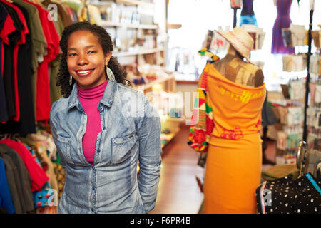 Black woman standing in store Stock Photo