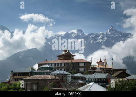 Kalpa village set against clouded Himalayan mountains in the Kinnaur district of Himachal Pradesh, Northern India, Stock Photo