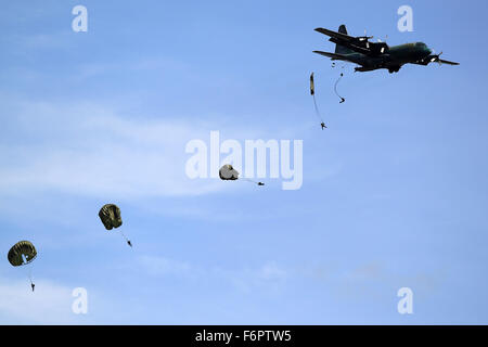 Pampanga Province, Philippines. 21st Dec, 2015. Paratroopers jump off a C-130 military plane during the celebration of the 80th founding anniversary of the Armed Forces of the Philippines inside the Clark Air Base in Pampanga Province, the Philippines, Dec. 21, 2015. Credit:  Rouelle Umali/Xinhua/Alamy Live News Stock Photo