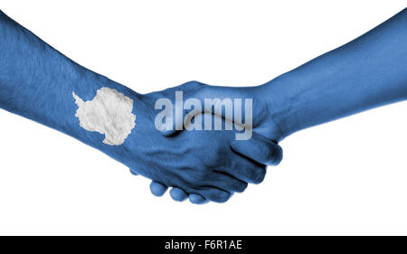 Man and woman shaking hands, wrapped in flag pattern, Antarctica Stock Photo