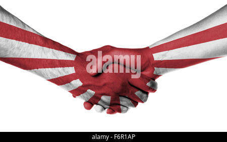 Man and woman shaking hands, wrapped in flag pattern, Japan Stock Photo