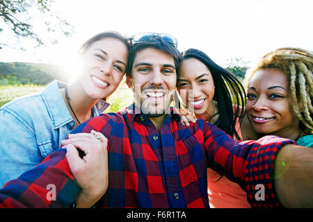 Friends taking selfie outdoors Stock Photo